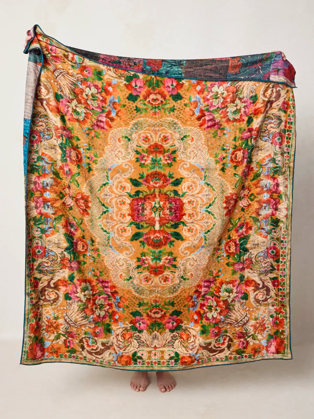 GOLDEN HOUR THROW WITH TAPESTRY PATTERNS IN ORANGE AND RED