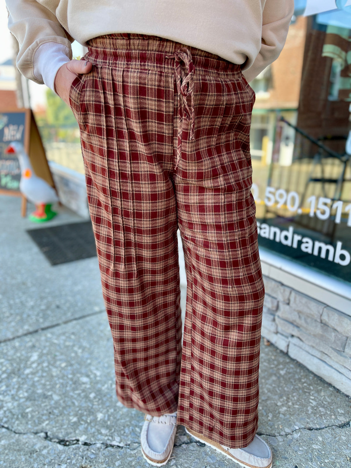 WOMAN IN PLAID PANTS