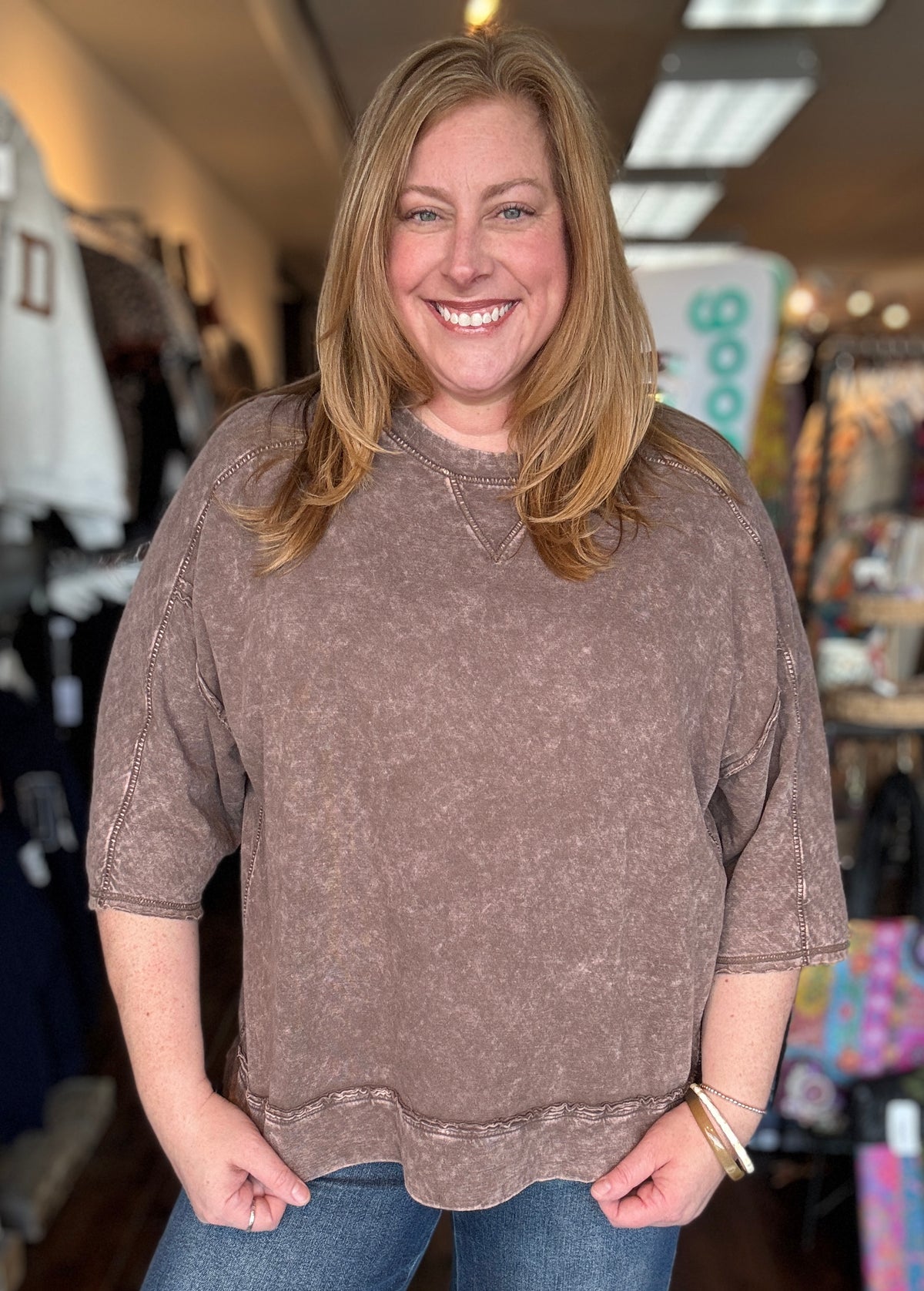 woman wearing a brown sweater