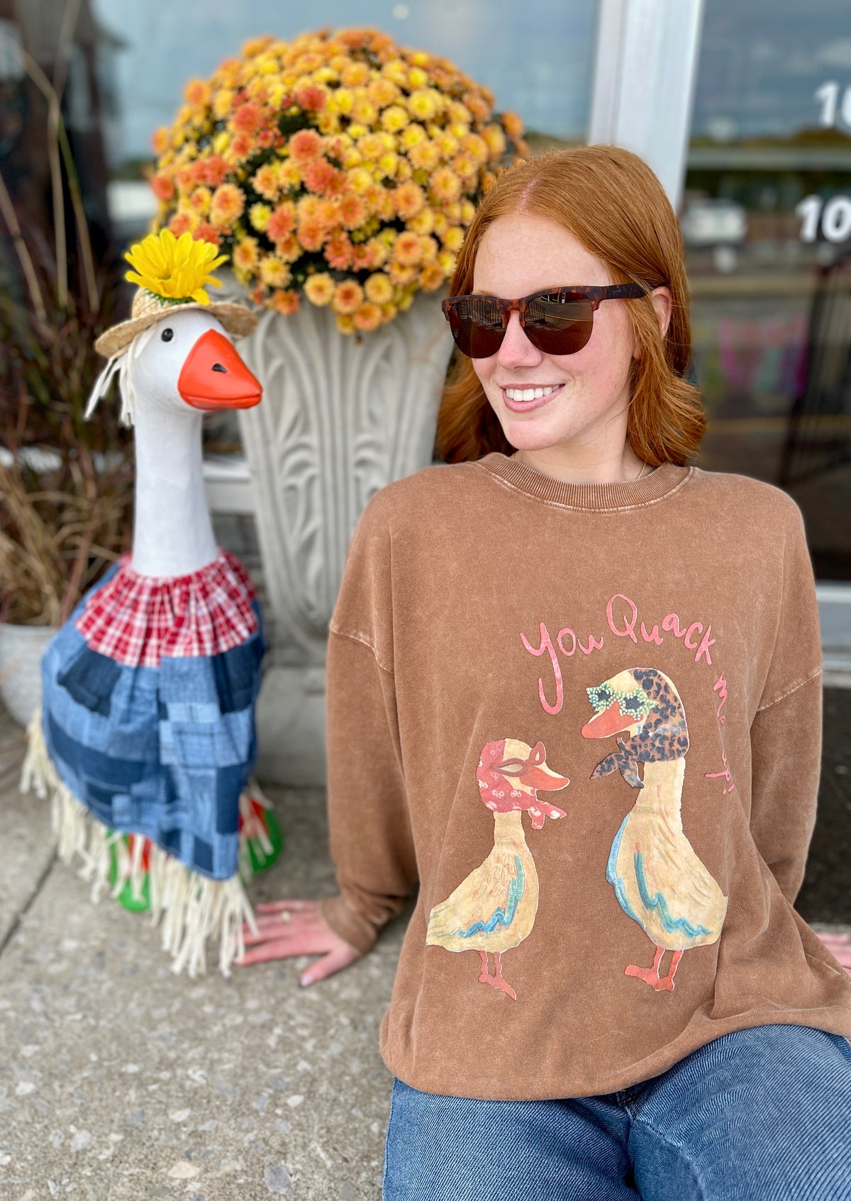 Brown shirt with 2 ducks wearing bandanas