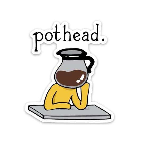 A die-cut sticker featuring a cartoon illustration of a person in a yellow shirt resting their head on a gray table, with a coffee pot over their head and the word 'pothead.' above them.