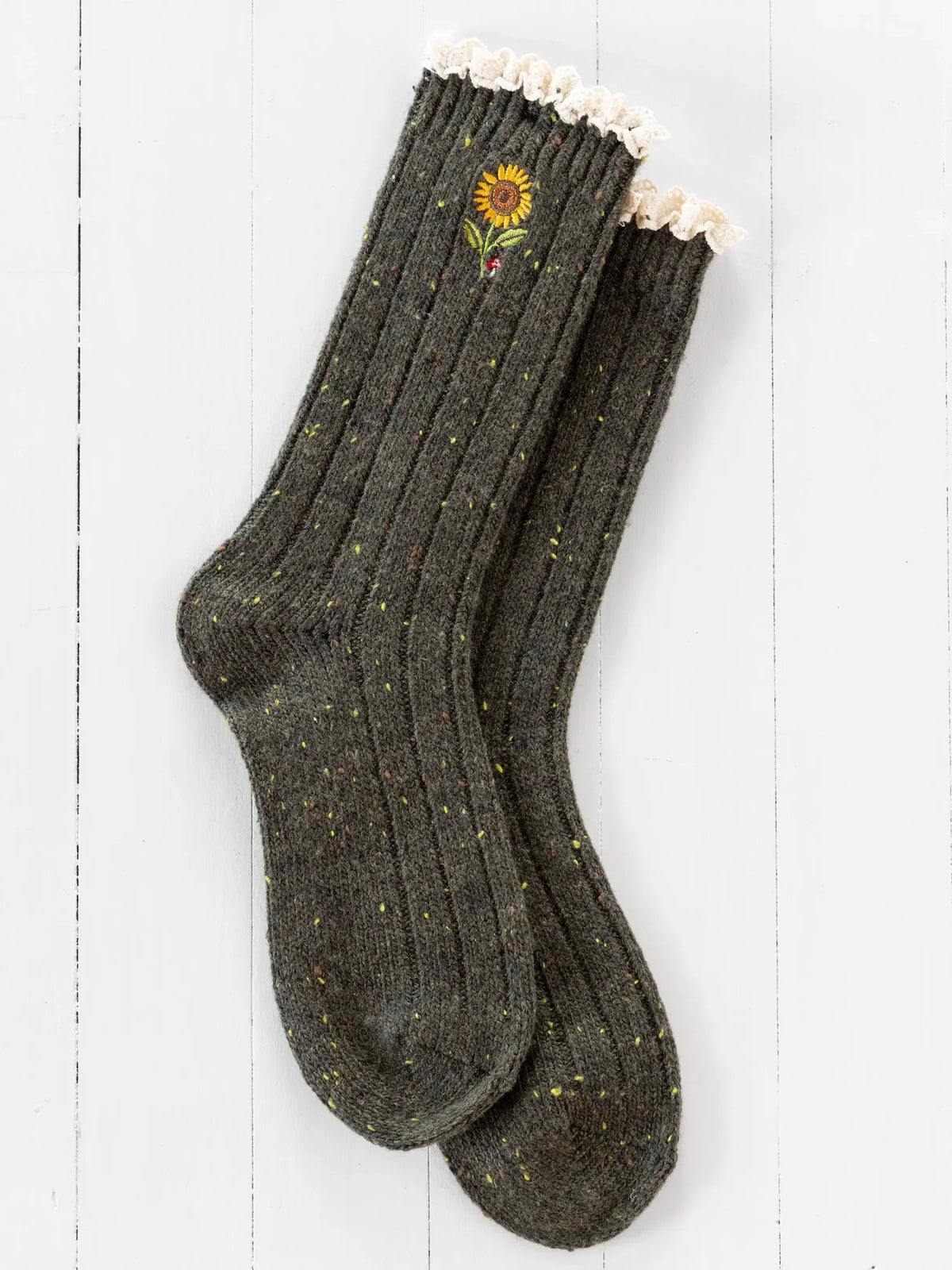 GREN SOCKS WITH WHITE HEM AND SUNFLOWER ON THEM ON WHITE BACKGROUND