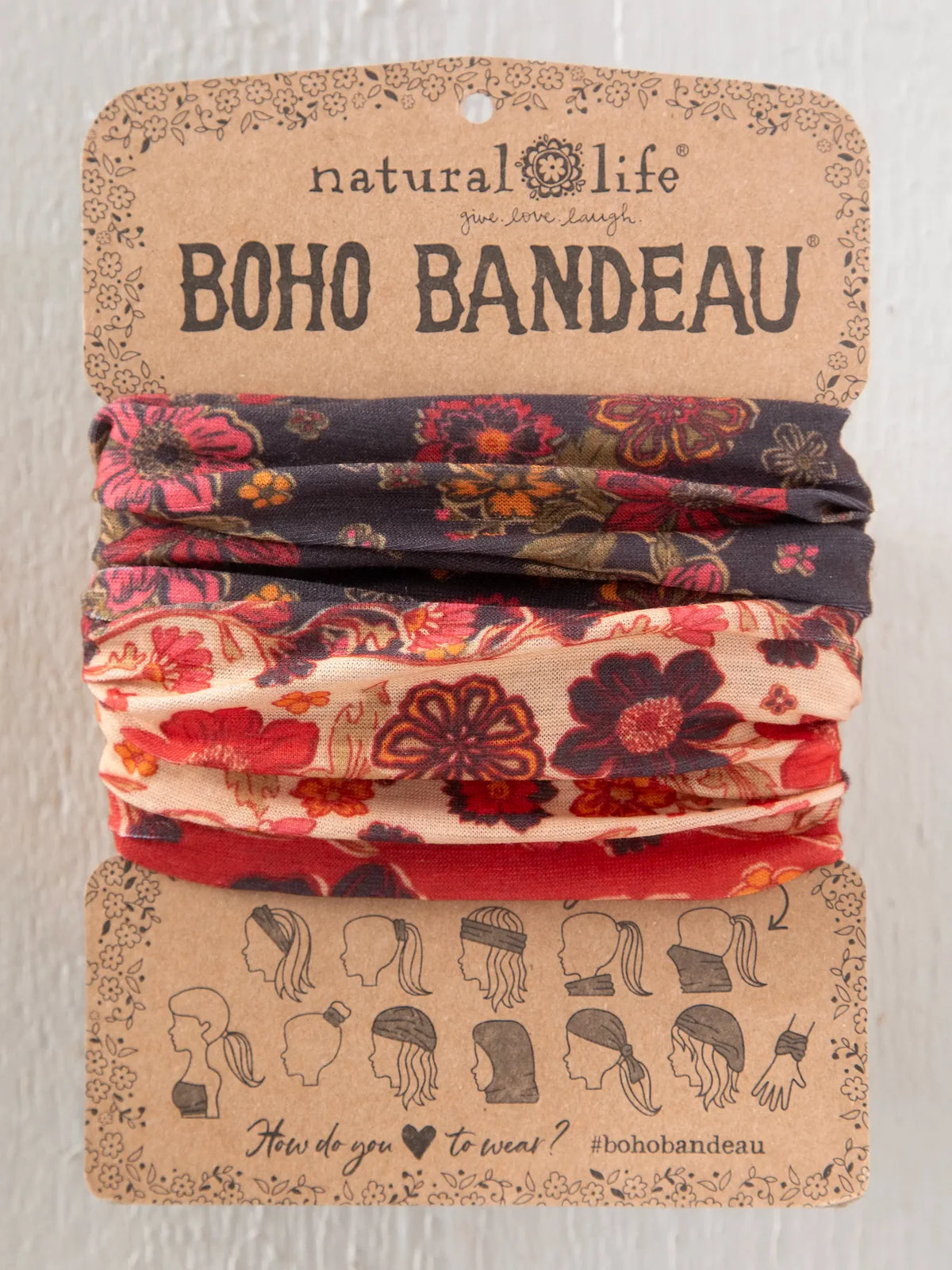 BOHO BANDEAU FROM NATRUAL LIFE IN RED AND BROWNS ON A CARDBOARD TAG