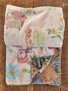 DOUBLE SIDED BLANKET ON WOOD FLOOR