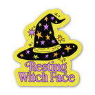 A die-cut sticker featuring a cartoon witch hat with stars and the text 'Resting Witch Face' in purple, shown on a plain white background.