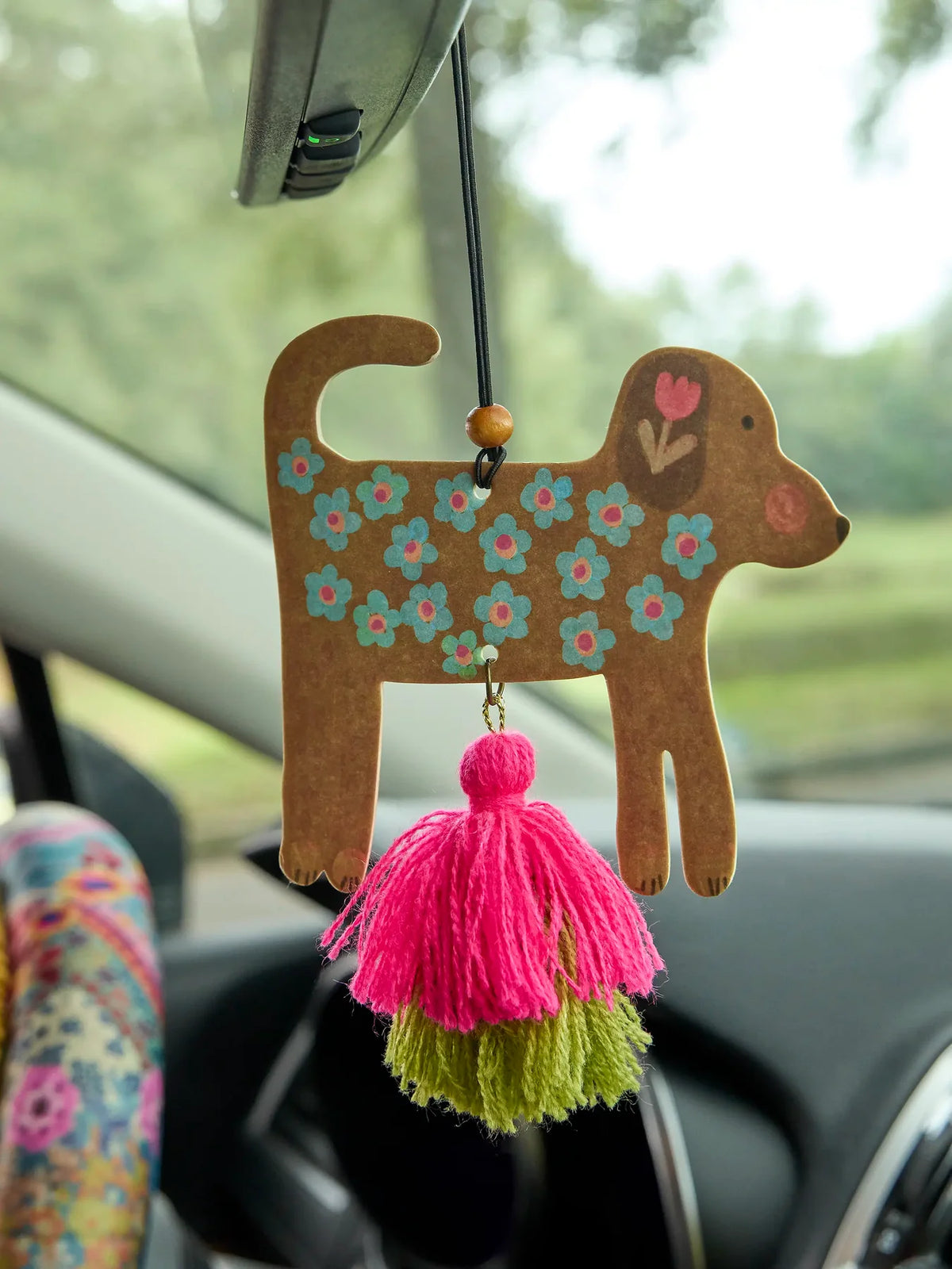 DOG AIR FRESHENER HANGING FROM REAR VIEW MIRROR