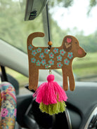 DOG AIR FRESHENER HANGING FROM REAR VIEW MIRROR
