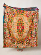 GOLDEN HOUR THROW WITH TAPESTRY PATTERNS IN ORANGE AND RED