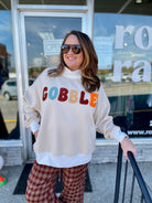 Woman in gobble mock neck sweatshirt