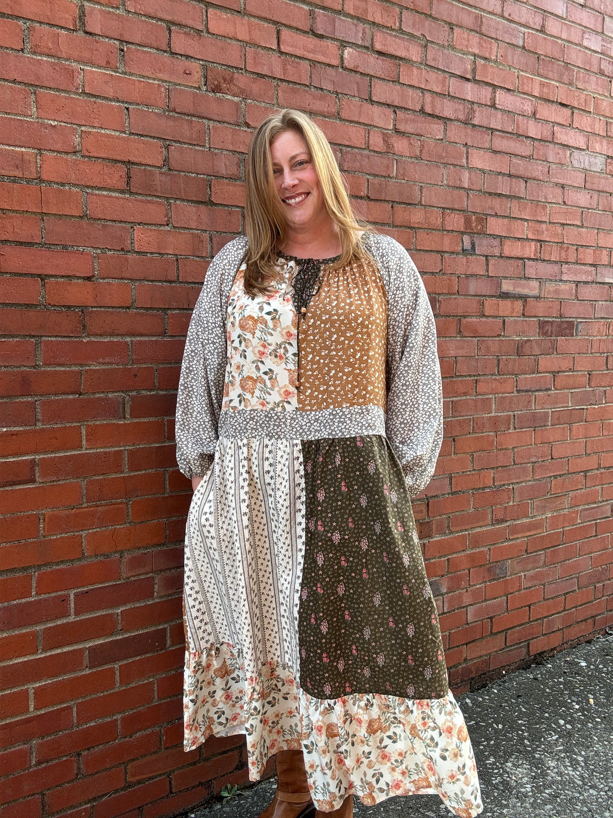 woman in brown and floral patch dress
