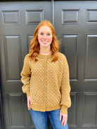 WOMAN WEARING CAMEL COLORED RAGLAN BALLOON SLEEVE BUTTON DOWN CARDIGAN