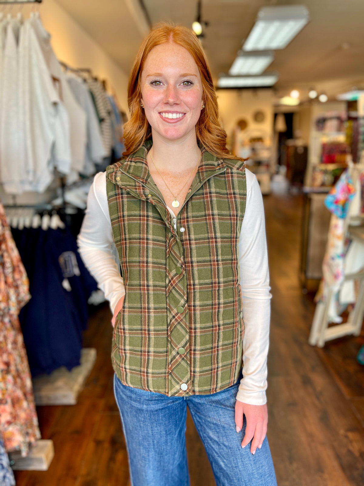 woman wearing olive plaid vest
