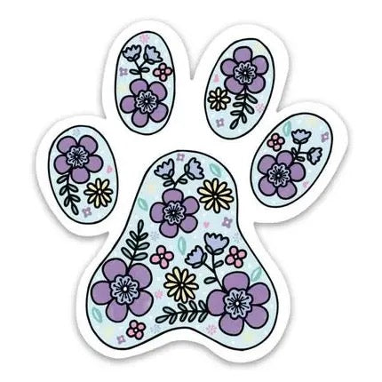 A die-cut sticker shaped like a paw print, decorated with a floral pattern in purple, pink, yellow, and green on a pale blue background, with a white border.