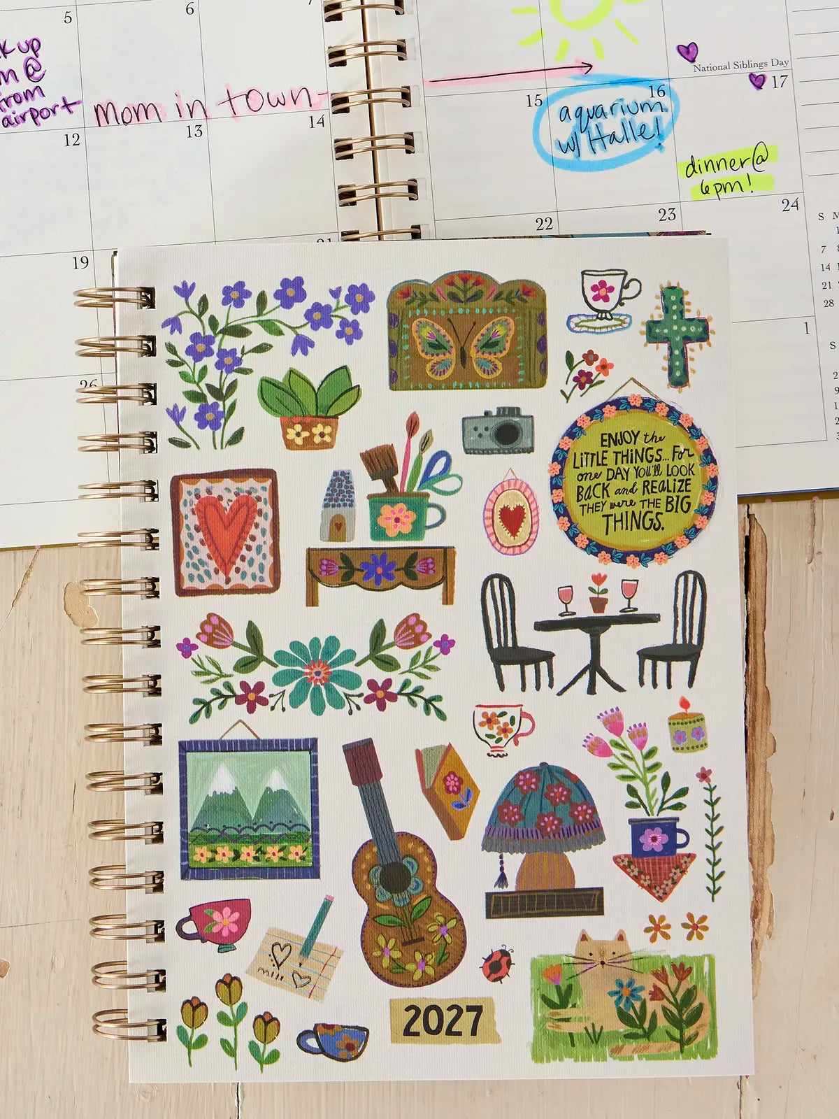 BOOK WITH ENJOY THE LITTLE THINGS ON THE FRONT AND MANY OTHER ICONS