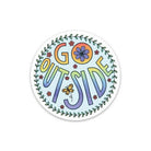 A round sticker featuring the phrase 'GO OUTSIDE' in colorful retro lettering, surrounded by a leafy border, flowers, and a butterfly on a white background.
