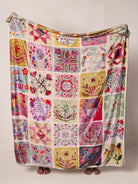 QUILT WITH BLOCKS ON IT IN MULTI COLOR WITH SAYINGS ON WHITE BACKGROUND