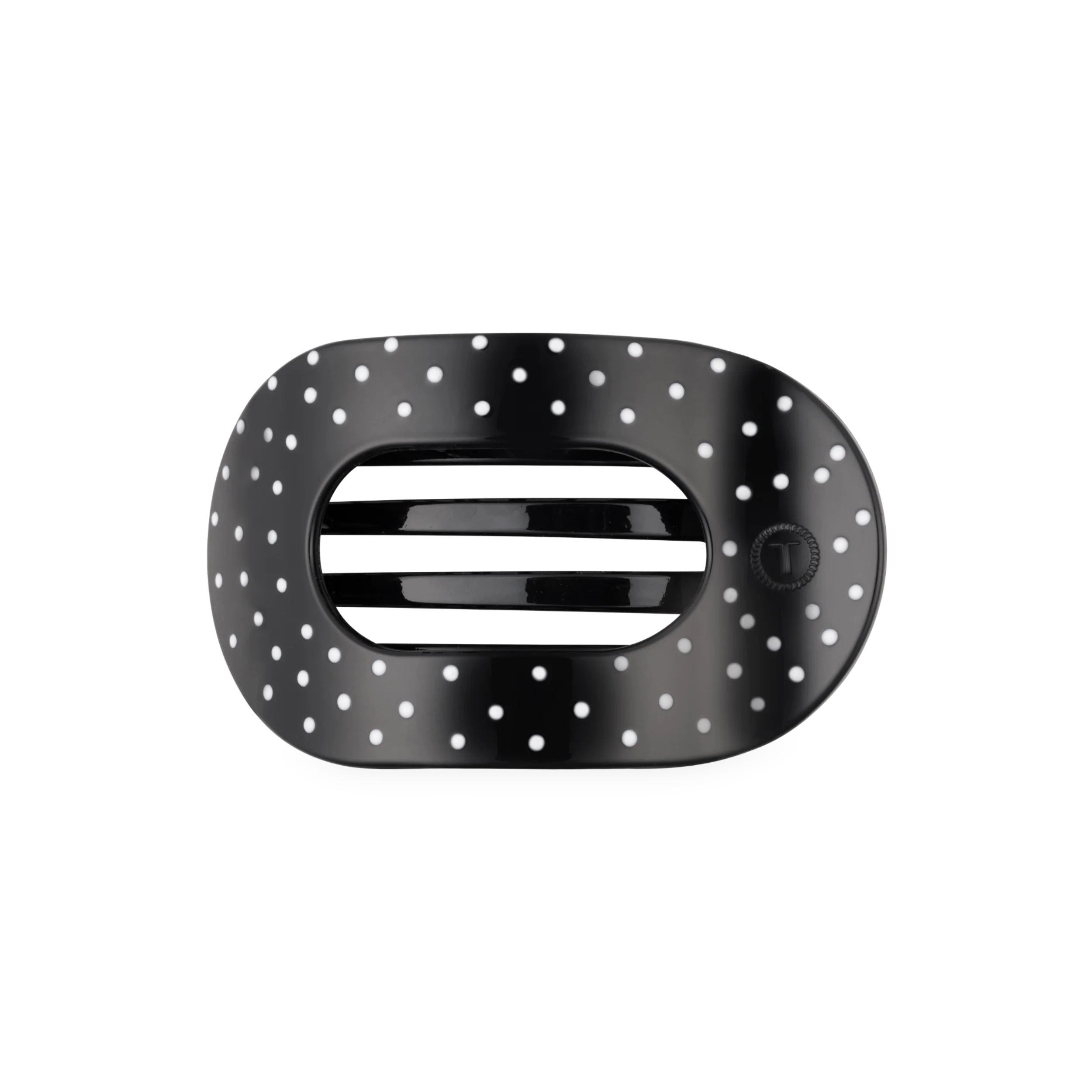 black hair clip with white polka dots