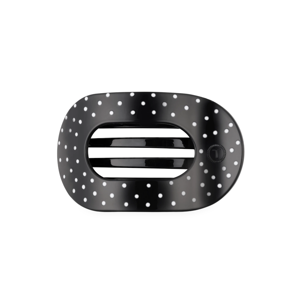 black hair clip with white polka dots